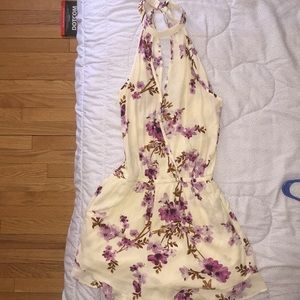 Cream colored romper w/ purple flowers!